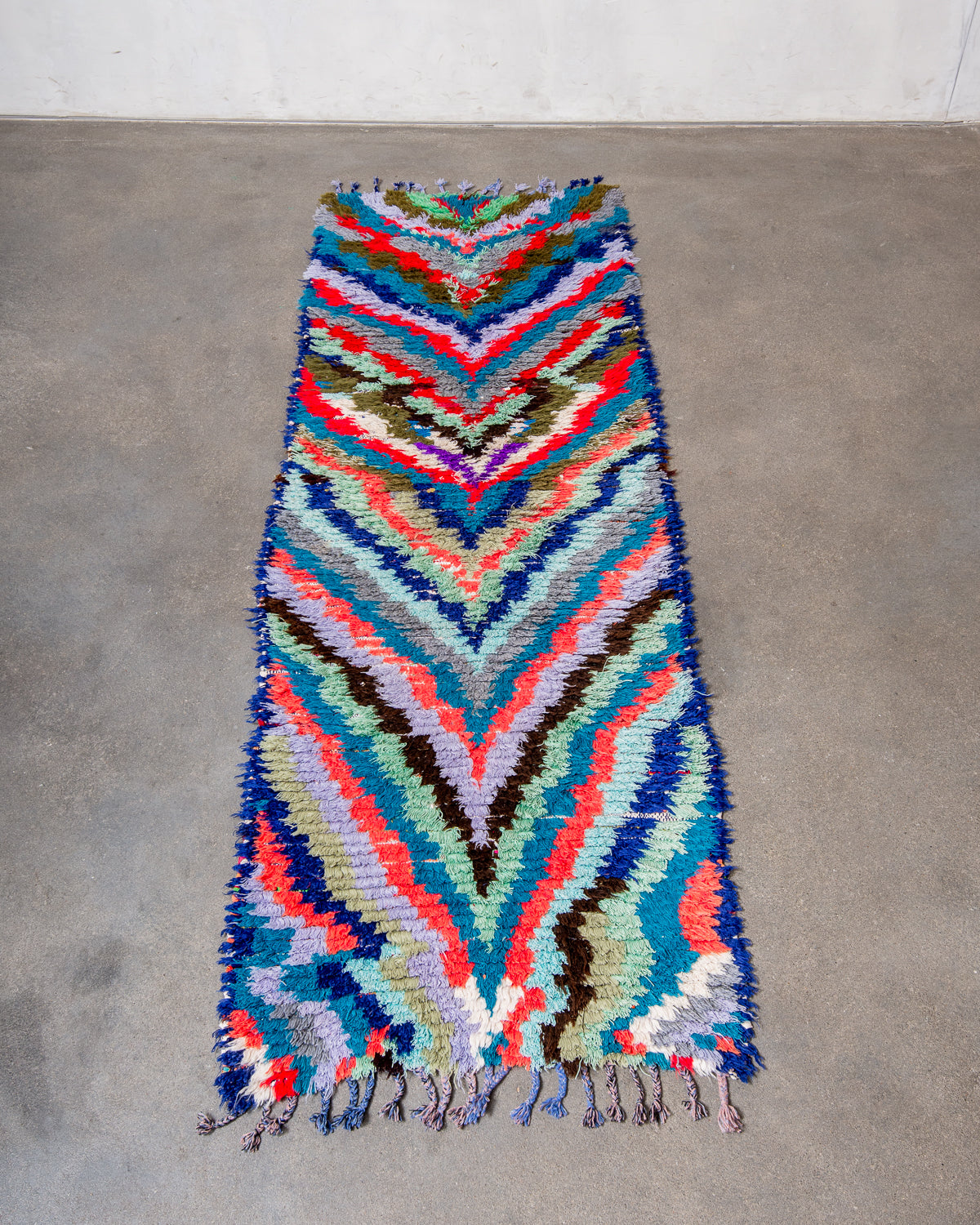 Modern designer vintage handcrafted Berber rug from Morocco. Boucherouite runner rug with beautiful colors and patterns.